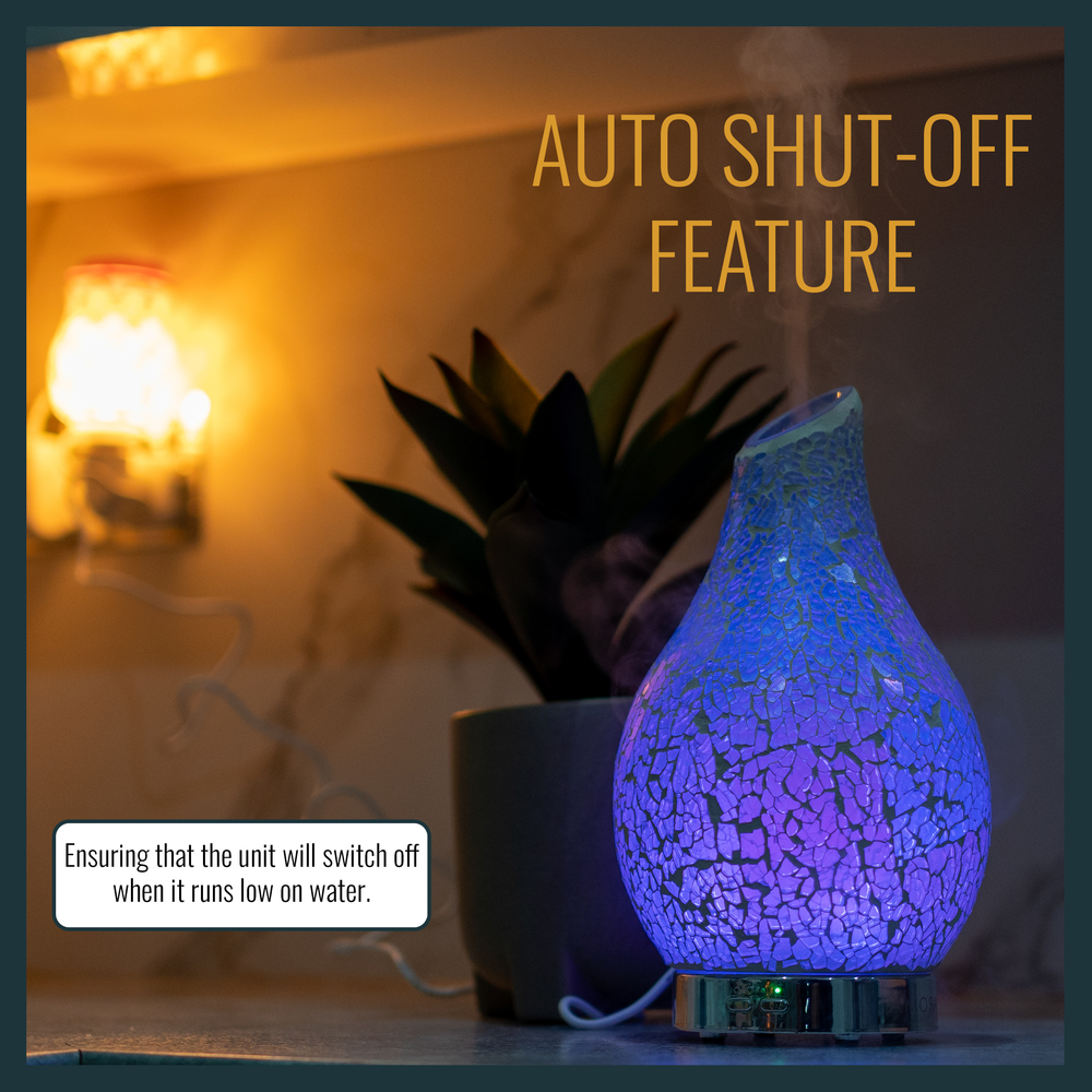 Electric Aroma diffuser with soft light and auto shut-off feature, creating a calming atmosphere in a dimly lit room for relaxation.