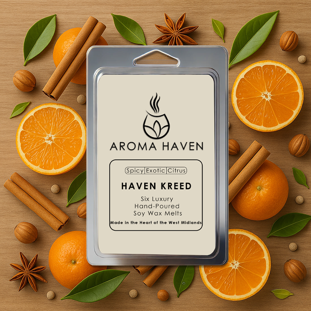 Aroma Haven wax melt package surrounded by oranges, cinnamon sticks, and nuts on a wooden background