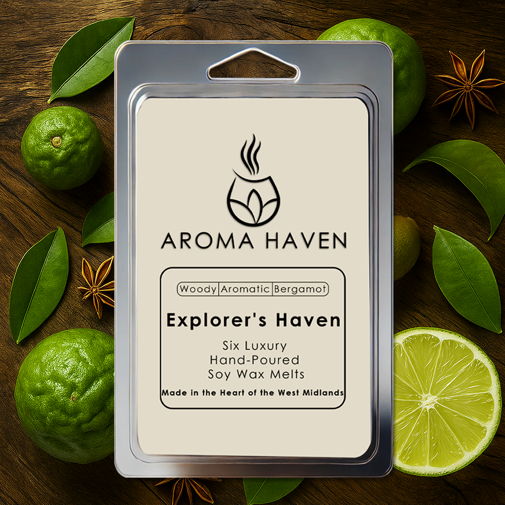 Aroma Haven wax melt package surrounded by green limes and leaves on a wooden surface